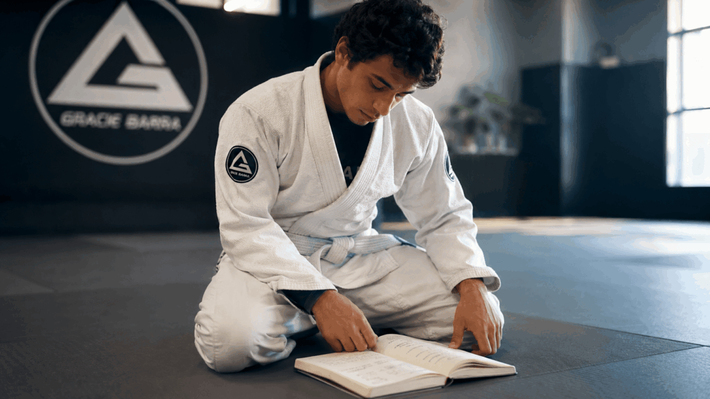 Manual completo para faixa branca de Jiu Jitsu com técnicas básicas de rolamentos, quedas, passagens e finalizações